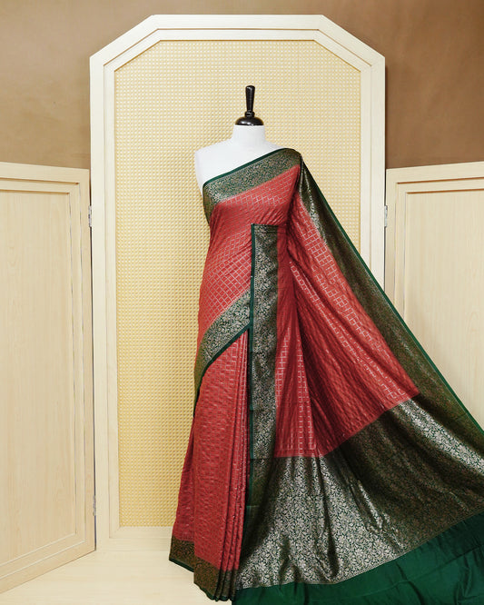 Brick brown Colour Semi georgette Saree having zari dotted check pattern on body, contrast dark forest green colour floral kodi designed Border, Rich Pallu comes with Matching Blouse piece.