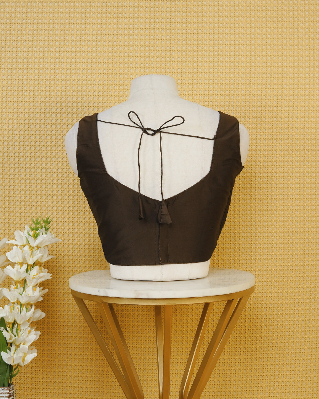 Brown colour Sleeveless Blouse Featuring A Stylish Sweetheart Neck, Smooth Finish, And A Comfortable Tailored Fit.