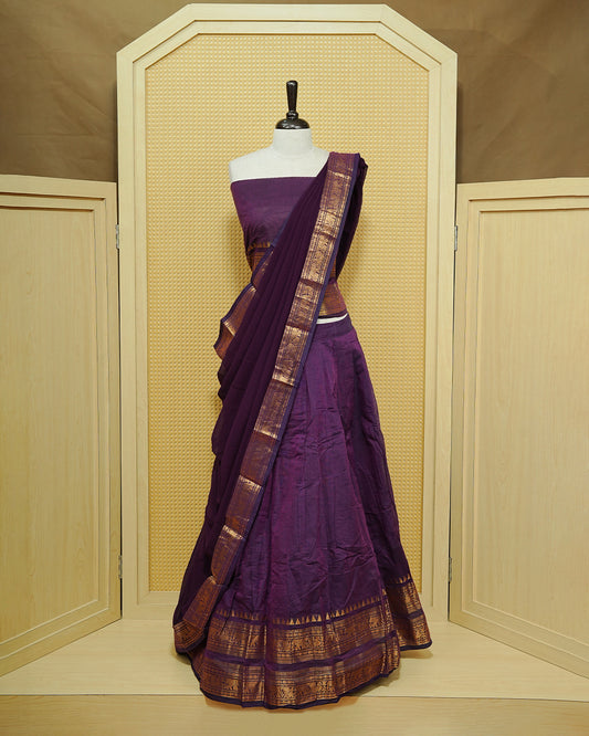 Purple colour Chettinad Semi Stitched dhavani set Featuring Self colour with Gold zari border on skirt, Matching Blouse & dupatta.