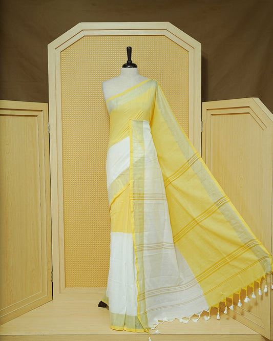 Yellow & White Colour Half & Half Mul cotton saree Complemented by contrast colour Gold Zari Border & tassels.