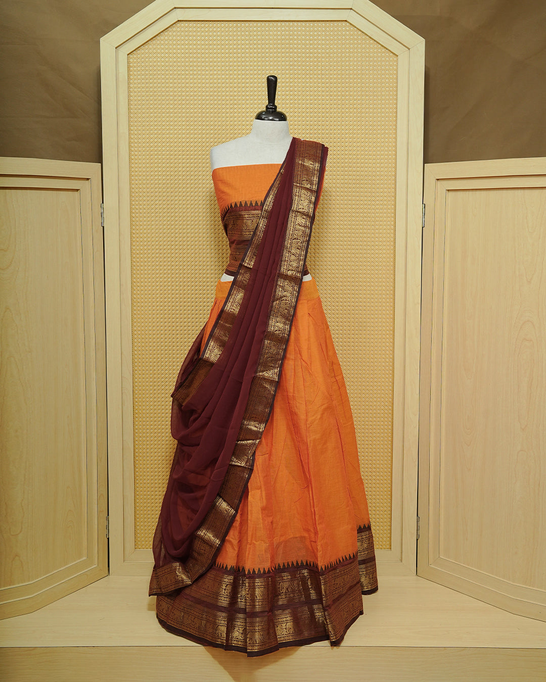 Orange colour Chettinad Semi Stitched dhavani set Featuring contrast Maroon with Gold zari border on skirt, Contrast Blouse & matching dupatta.