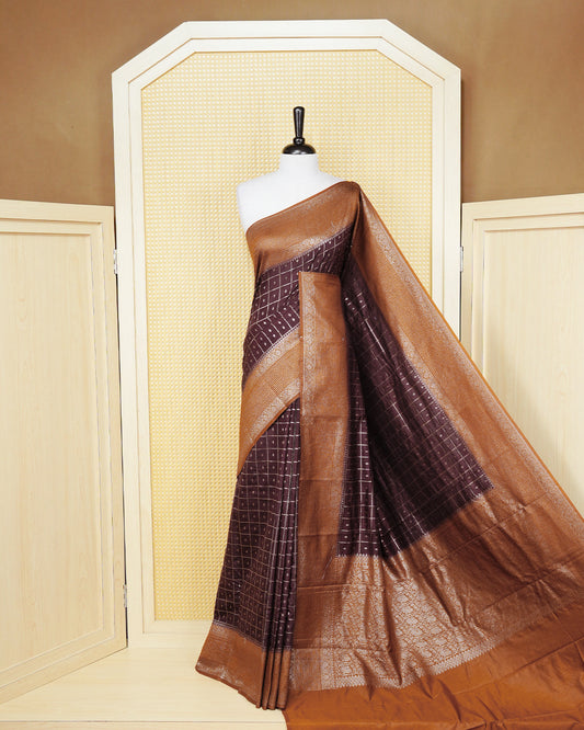 Dark brown Colour Semi georgette Saree having zari check with buttas pattern on body, contrast dark mustard colour floral designed border, Rich Pallu comes with Matching Blouse piece.