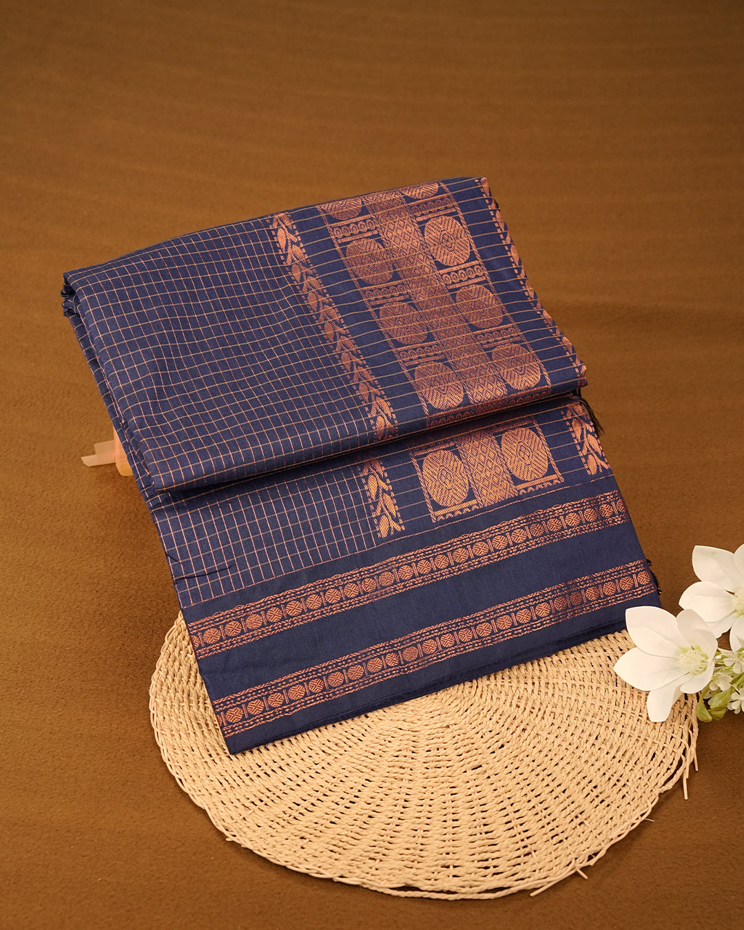 Navy Blue colour kalyani cotton saree featuring zari check pattern on body, complemented by Contrast colour with Antique zari border, paired with matching blouse piece