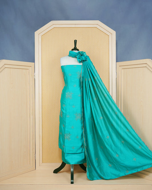 Teal Blue Georgette Salwar Material Features an Elagent Floral Emproidary Pattern Aborned With Shimmering Metallic Gold Thread and Beadwork, paired with matching bottom & elegant Duptta