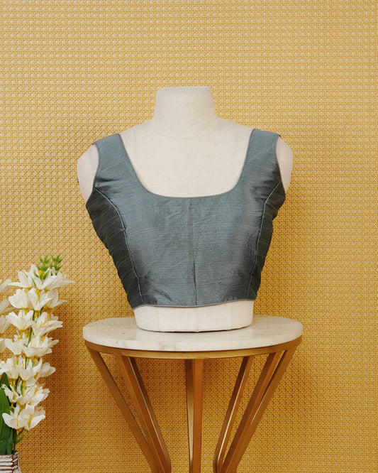 Steel Grey colour Sleeveless Blouse Featuring A Classic Scoop Neck, Smooth Finish, And A Comfortable Tailored Fit.
