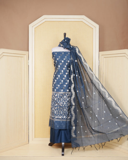 Navy Blue colour salwar material featuring gold zari motif pattern without border, paired with matching bottom and elegant dupatta.