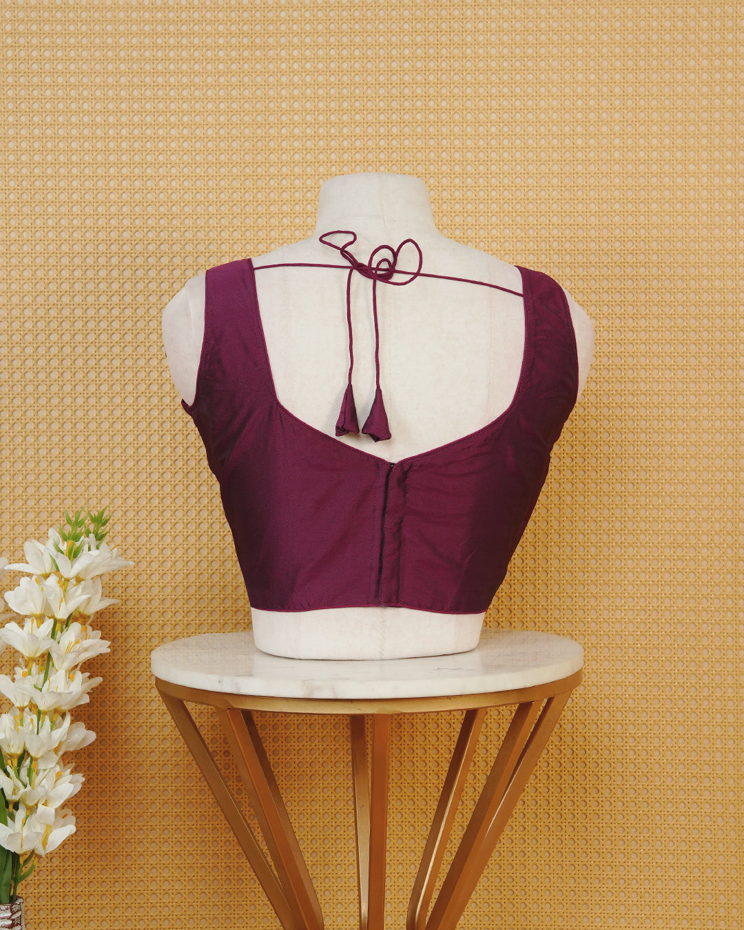 Burgundy colour Sleeveless Blouse Featuring A Stylish Sweetheart Neck, Smooth Finish, And A Comfortable Tailored Fit.