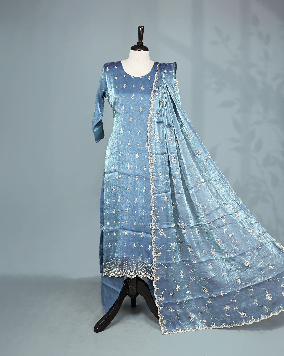 Steel colour Salwar set comes top with Stone work on body, paired with matching bottom and dupatta.
