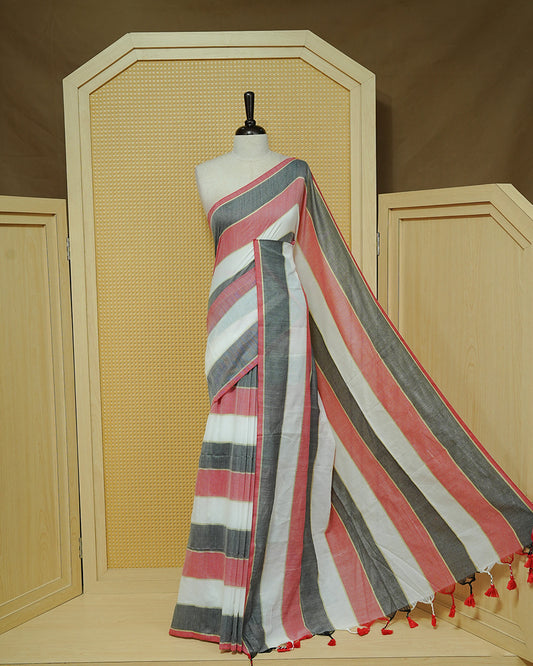 Off White,Charcoal Grey & Red Striped Mul Cotton Saree featuring bold striped patterns in white, charcoal grey, and Red, finished with delicate red tassels.