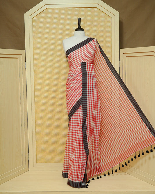 Red & Off-White Checked Mul Cotton Saree featuring an elegant all-over checked pattern, complemented by a black striped contrast border and matching black tassels.