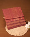 Maroon colour kalyani cotton saree featuring gold zari check pattern on body, complemented by Brown colour with Antique zari border, paired with matching blouse piece