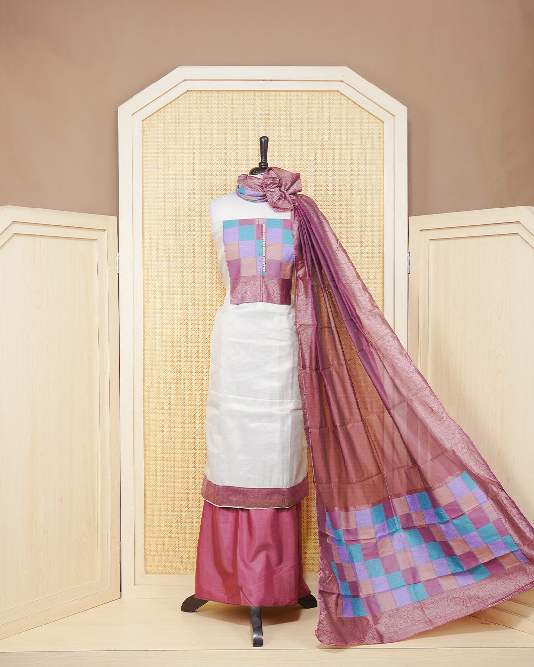 Cream colour Tissue Salwar Material Featuring Plain Body, multi colour check pattern on chest portion Paired With a Matching Bottom and an Elegant Dupatta.