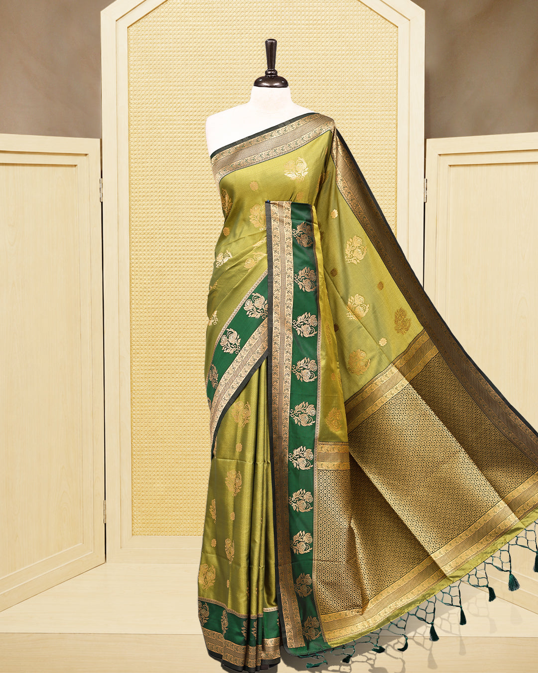 Olive green & gold double shade Mulberry silk saree featuring floral gold zari patterns on body, paired with contrast forest green colour with traditional border, comes with matching blouse piece.
