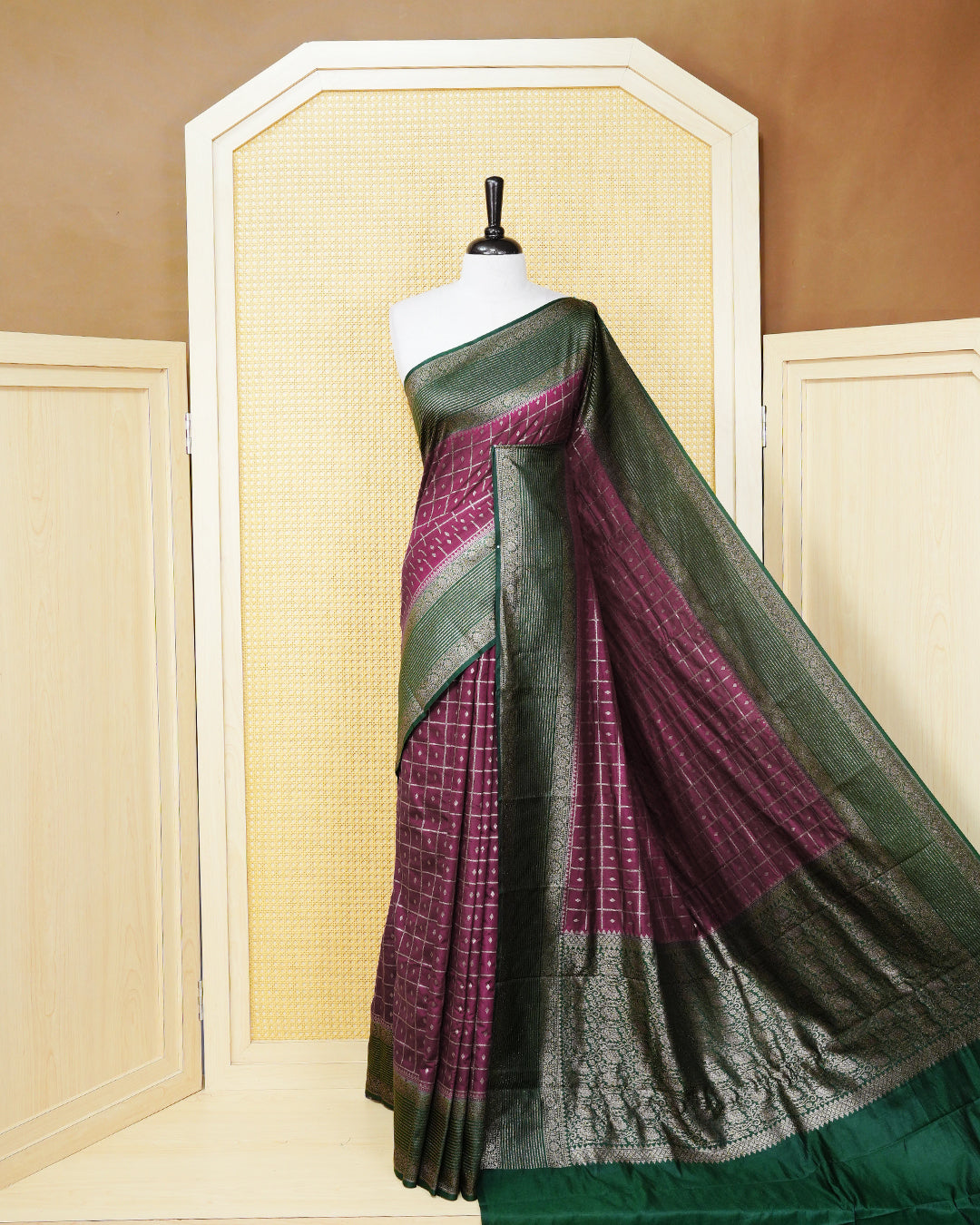 Grape Colour Semi georgette Saree having zari check with buttas pattern on body, contrast dark green colour floral designed border, Rich Pallu comes with Matching Blouse piece.