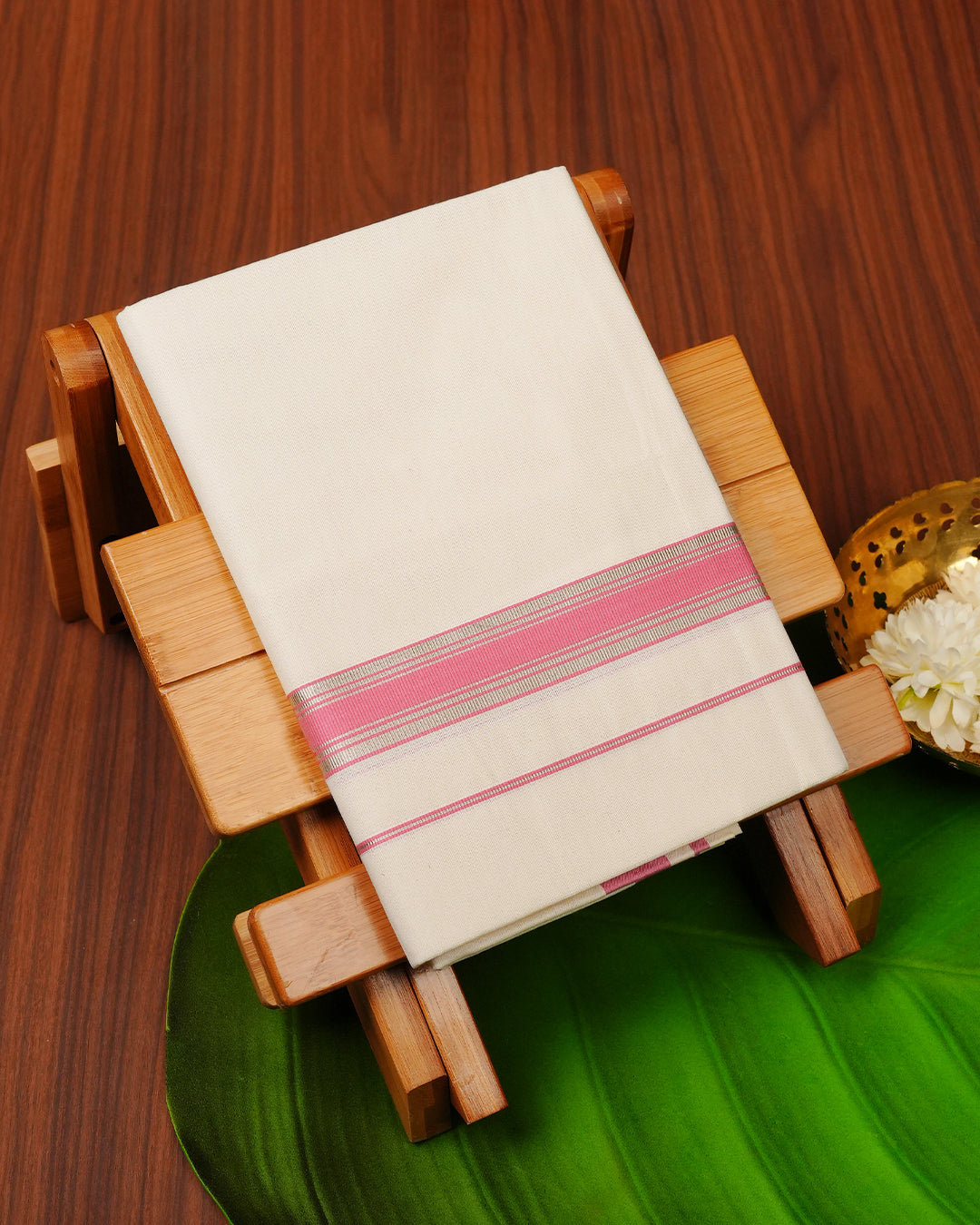 Cream colour cotton single dhoti featuring pink colour with silver zari border.