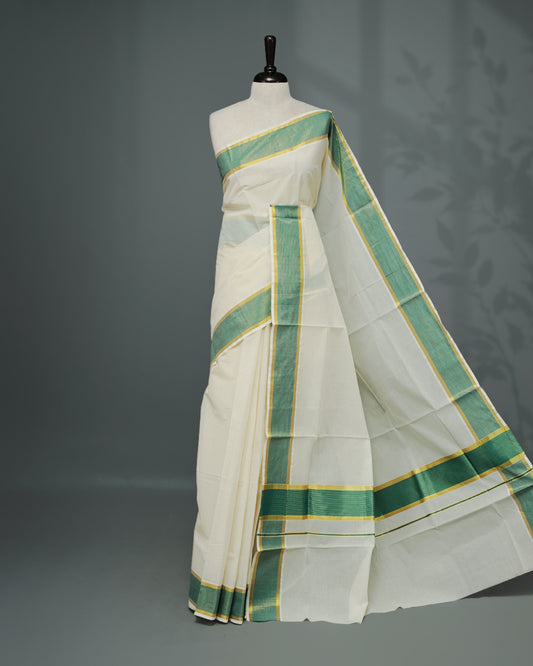 Cream colour Kerala saree Featuring an Elegant plain body, complemented by a classic gold & Green zari border, matching blouse piece.