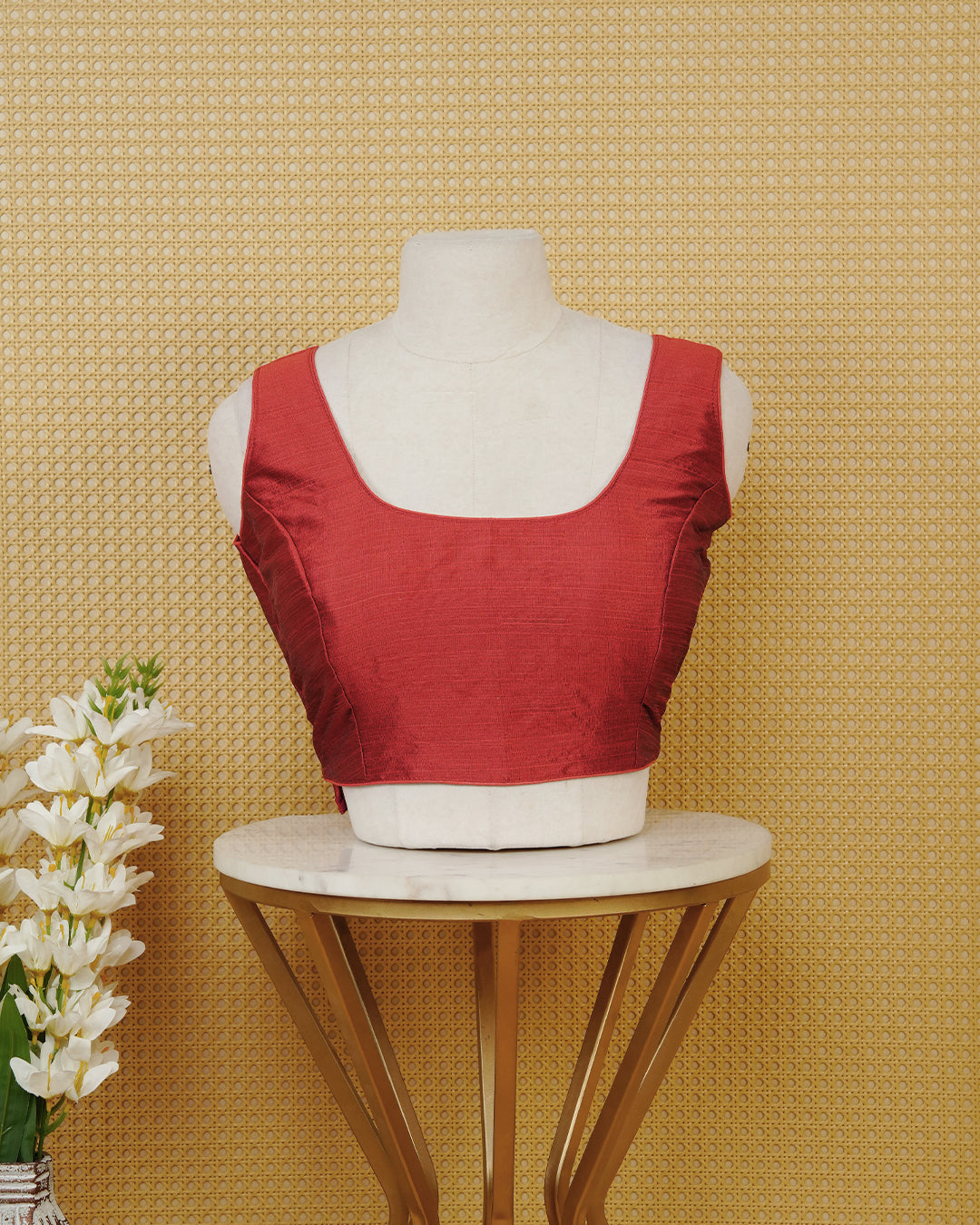 Red colour Sleeveless Blouse Featuring A Classic Scoop Neck, Smooth Finish, And A Comfortable Tailored Fit.