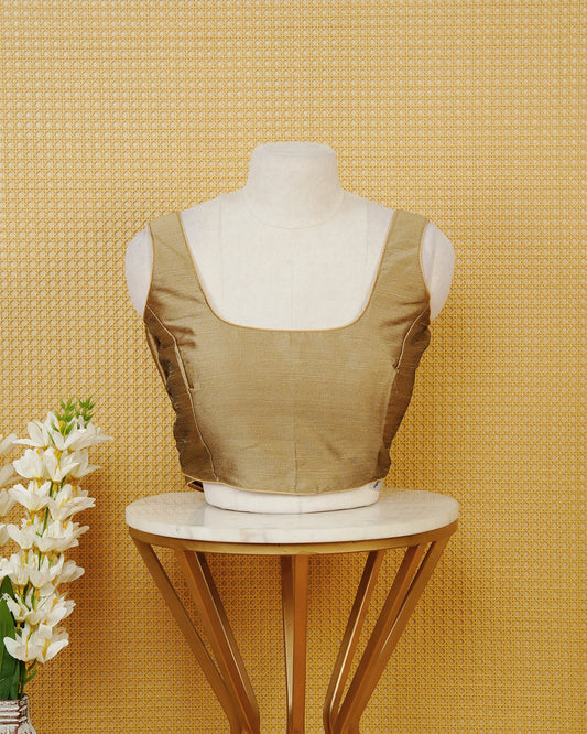 Light Gold colour Sleeveless Blouse Featuring A Classic Scoop Neck, Smooth Finish, And A Comfortable Tailored Fit.