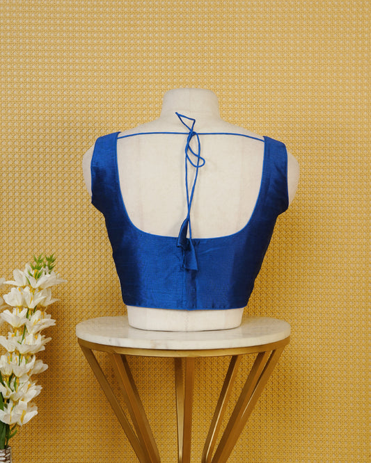 Blue Colour Plain Blouse Featuring A Classic U Neckline, Sleeveless Design, And A Simple, Clean Finish.
