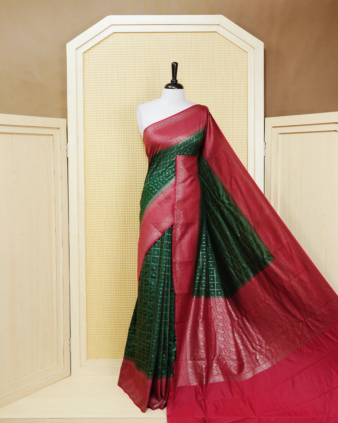 Dark green Colour Semi georgette Saree having zari check with buttas pattern on body, contrast red colour floral designed border, Rich Pallu comes with Matching Blouse piece.
