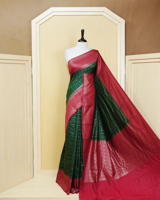 Dark green Colour Semi georgette Saree having zari check with buttas pattern on body, contrast red colour floral designed border, Rich Pallu comes with Matching Blouse piece.