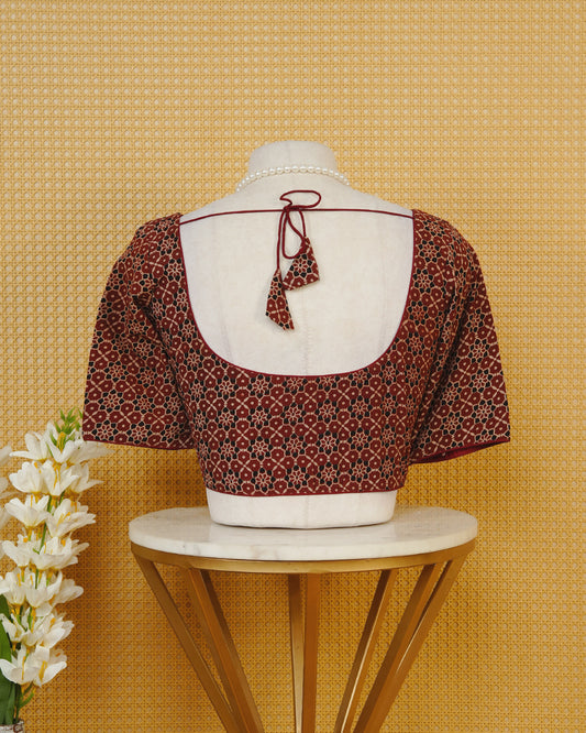 Maroon Colour Blouse Featuring A Classic U-Neck, Intricate Floral Geometric Print, And Comfortable Elbow Length Sleeves.