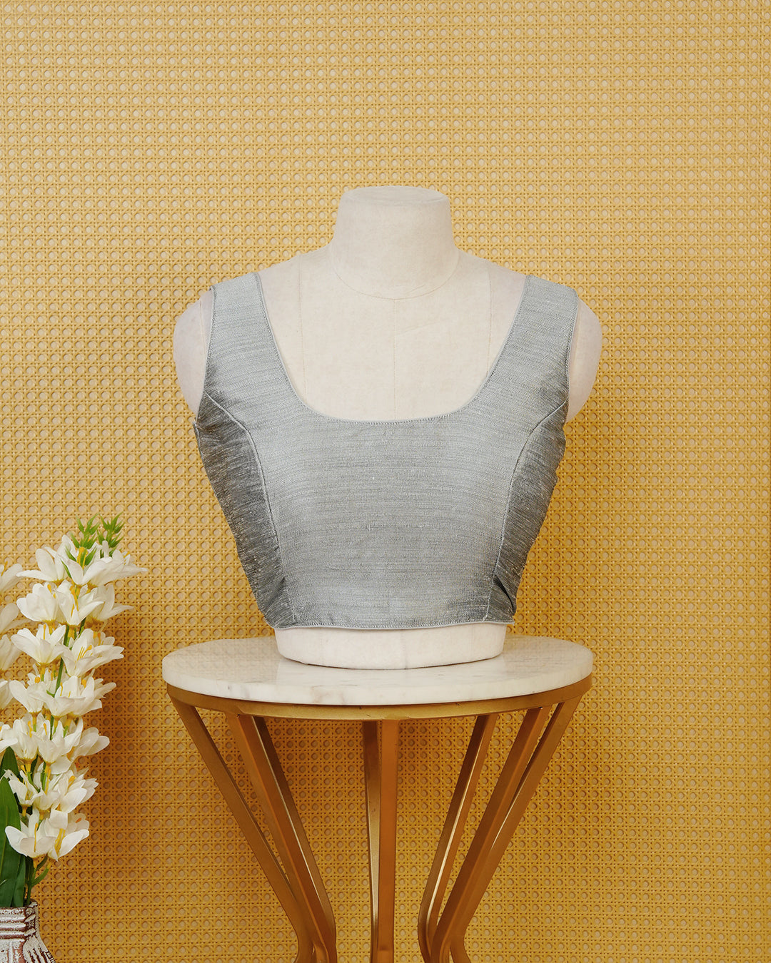 Silver colour Sleeveless Blouse Featuring A Classic Scoop Neck, Smooth Finish, And A Comfortable Tailored Fit.