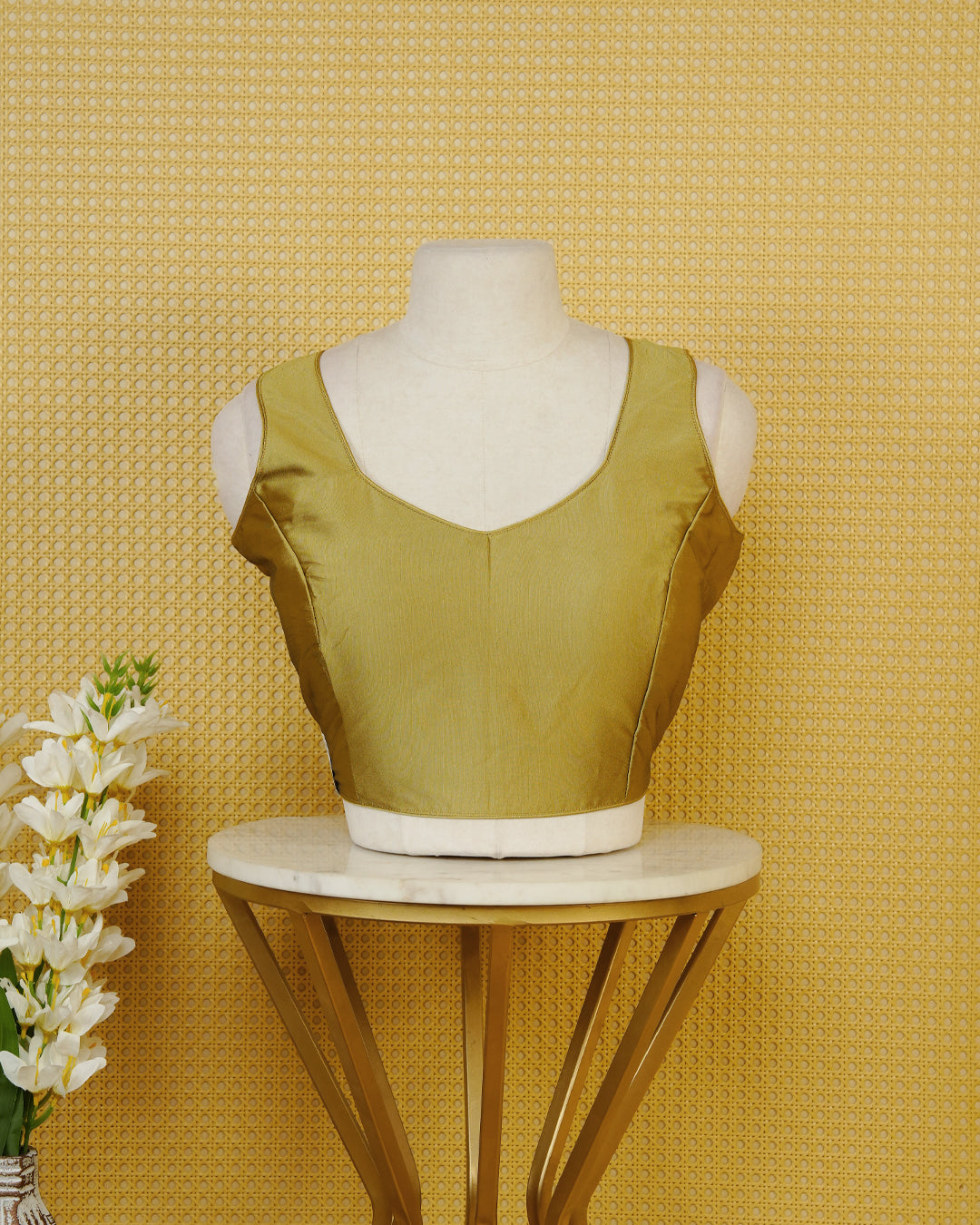 Olive colour Sleeveless Blouse Featuring A Stylish Sweetheart Neck, Smooth Finish, And A Comfortable Tailored Fit.