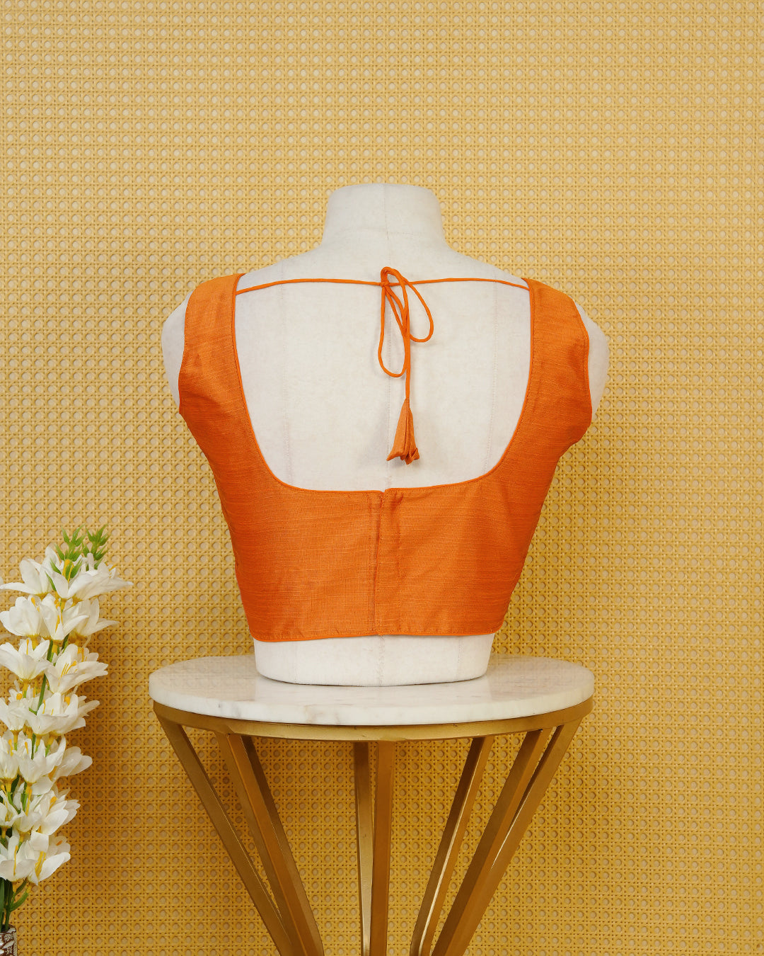 Orange Colour Plain Blouse Featuring A Classic U Neckline, Sleeveless Design, And A Simple, Clean Finish.