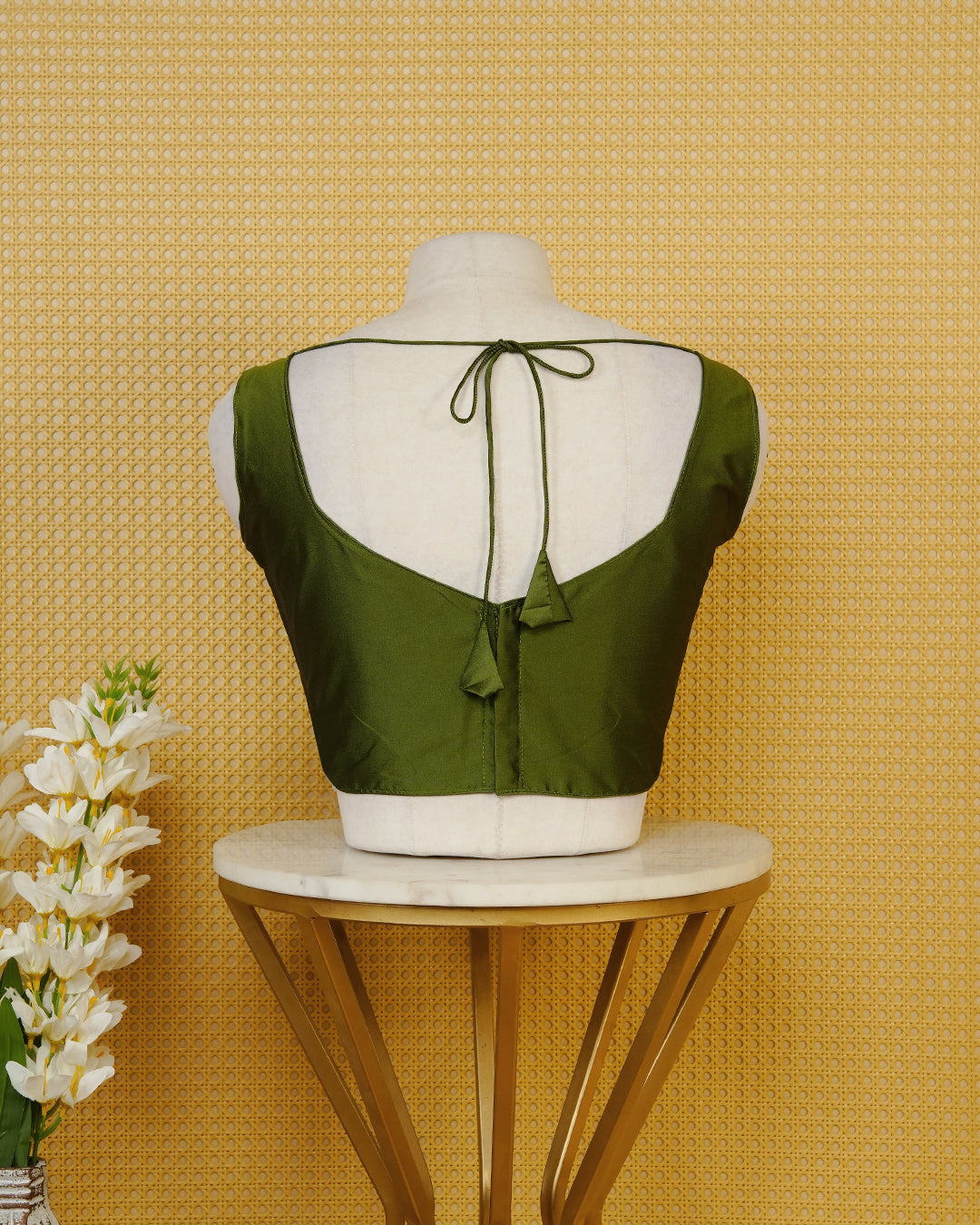 Green colour Sleeveless Blouse Featuring A Stylish Sweetheart Neck, Smooth Finish, And A Comfortable Tailored Fit.