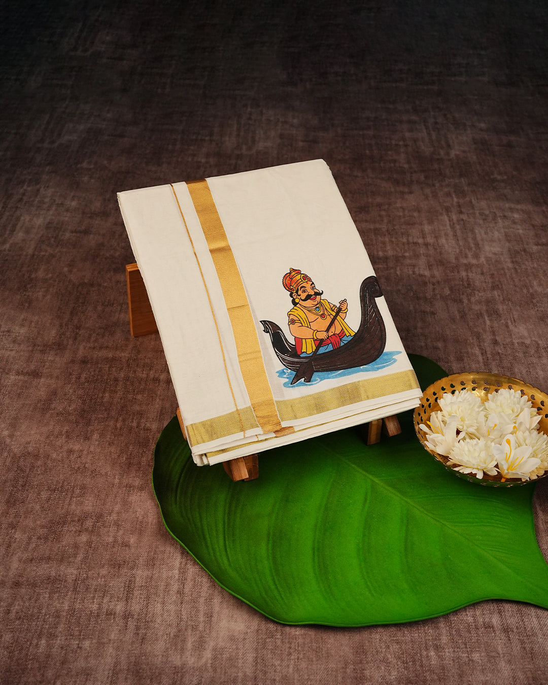 Cream Coloured Cotton Double Dhoti Finished with Onam Themed Prints & Gold Kara