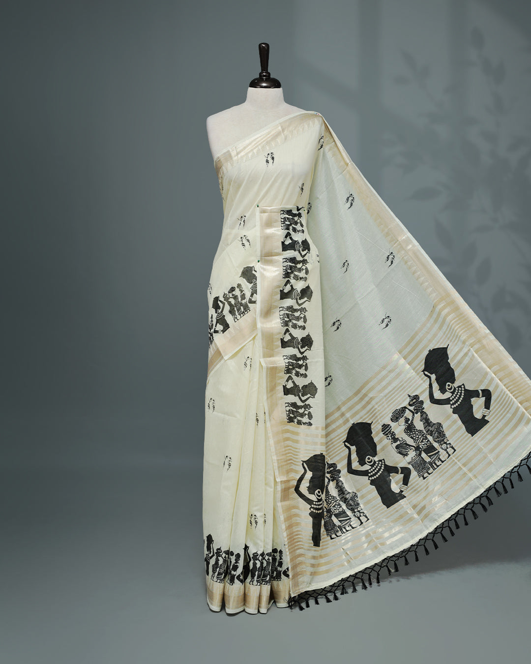 Cream colour Semi chanderi kerala saree featuring Black colour Print on body, complemented by Light Gold zari Border, paired with matching blouse piece.