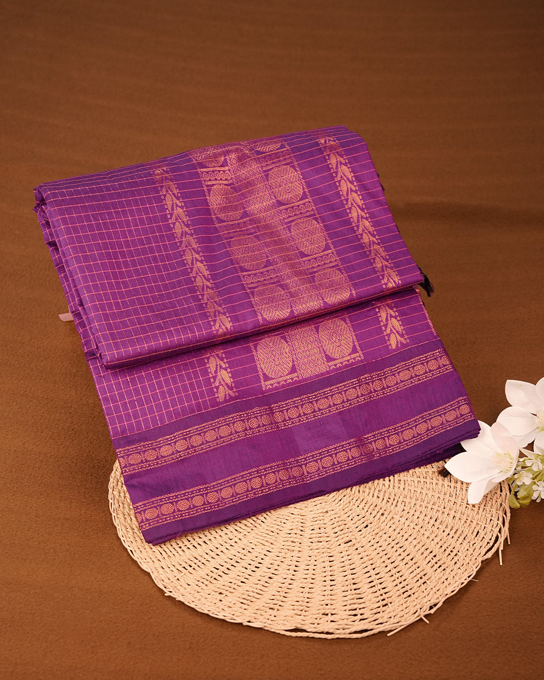 Purple colour kalyani cotton saree featuring zari check pattern on body, complemented by Contrast colour with Antique zari border, paired with matching blouse piece