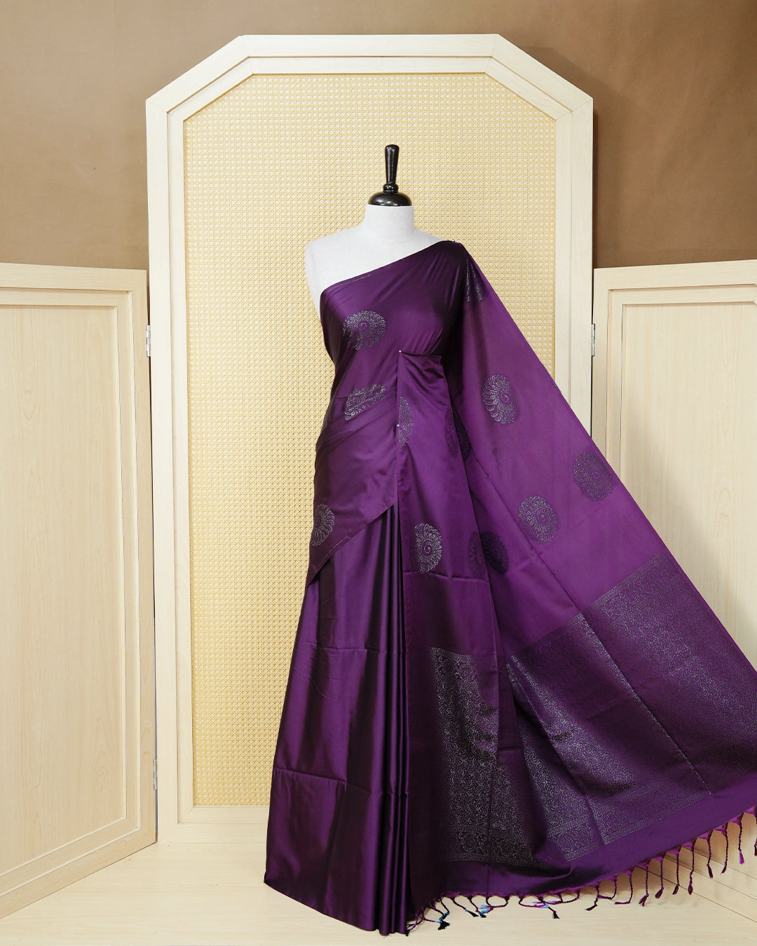 Deep purple colour soft silk saree featuring antique zari motifs on body with contrast self colour pallu & paired with matching blouse piece.