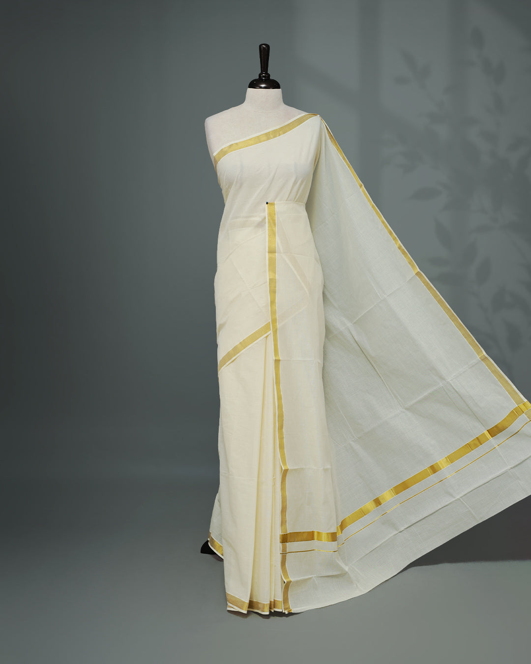 Cream colour Kerala saree Featuring an Elegant plain body, complemented by a classic simple gold zari border, matching blouse piece.