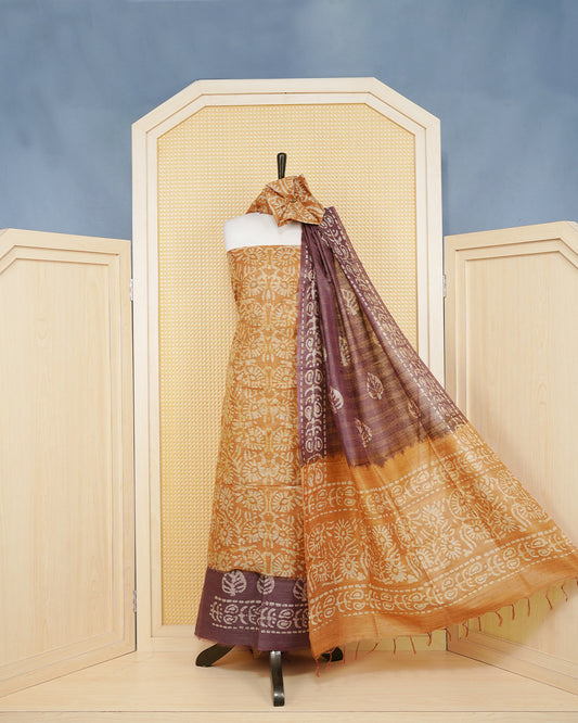 Brown Cotten Silk Salwar Mateirial Features an Elegant Floral Batik Print Pattern Aborned With Fine Weaved Zari highlights, Paired with matching bottom & elegant Dupatta