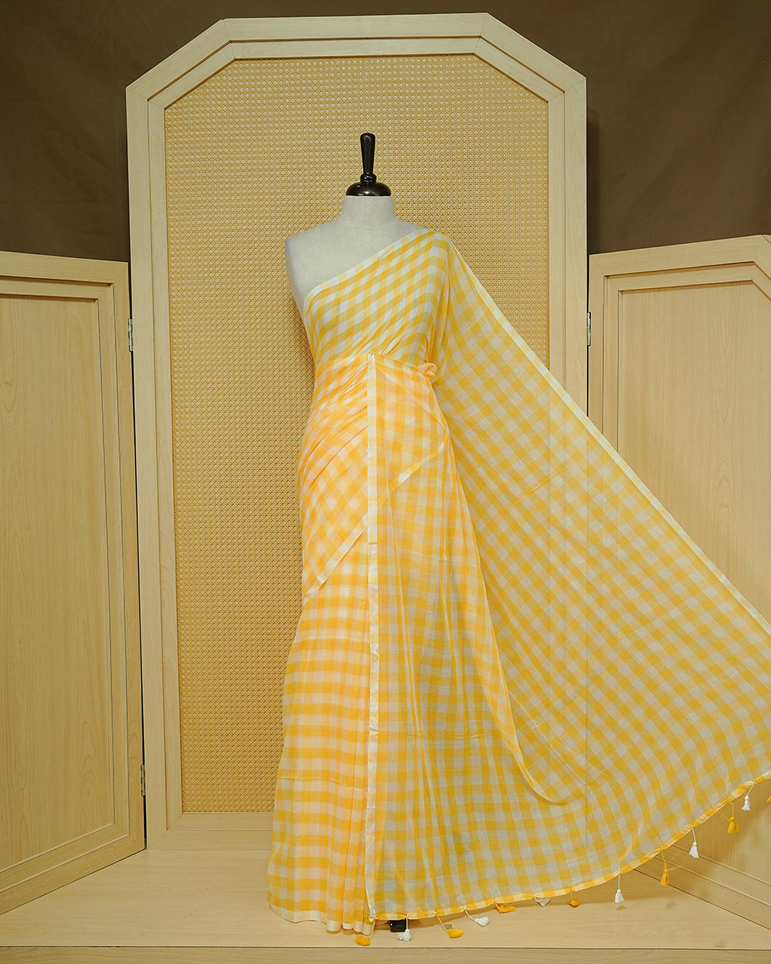 Yellow & white Mul cotton saree featuring Small Check pattern across body, complemented by Elegant Tassels.