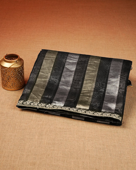 Black Pure Net Designer saree featuring Gold & silver strip design body, associate with Thread embroidery work on border, comes with matching blouse piece.