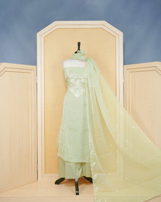 Pastal Green Georgette Salwar Material Features an Inrcate Floral Emproidary Pattern Aborned With Shimmering Sequin Accents, paired with matching bottom & elegant Duptta