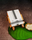Off White Colour Cotton Double Dhoti Finished With A Black Designed Pattern On Silver kara.