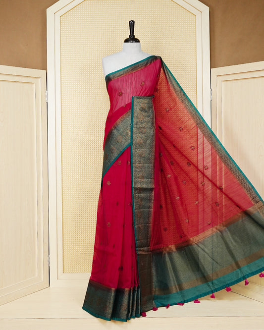 Magenta colour semi linen saree thread motifs on body, contrast teal green colour gold zari border, rich pallu comes with matching blouse piece