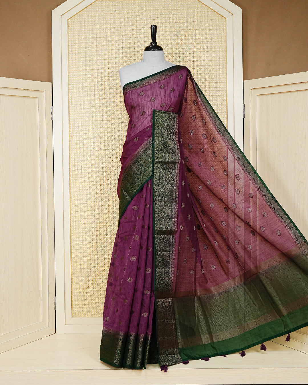 Onion pink colour semi linen saree thread motifs on body, contrast dark forest green colour gold zari border, rich pallu comes with matching blouse piece