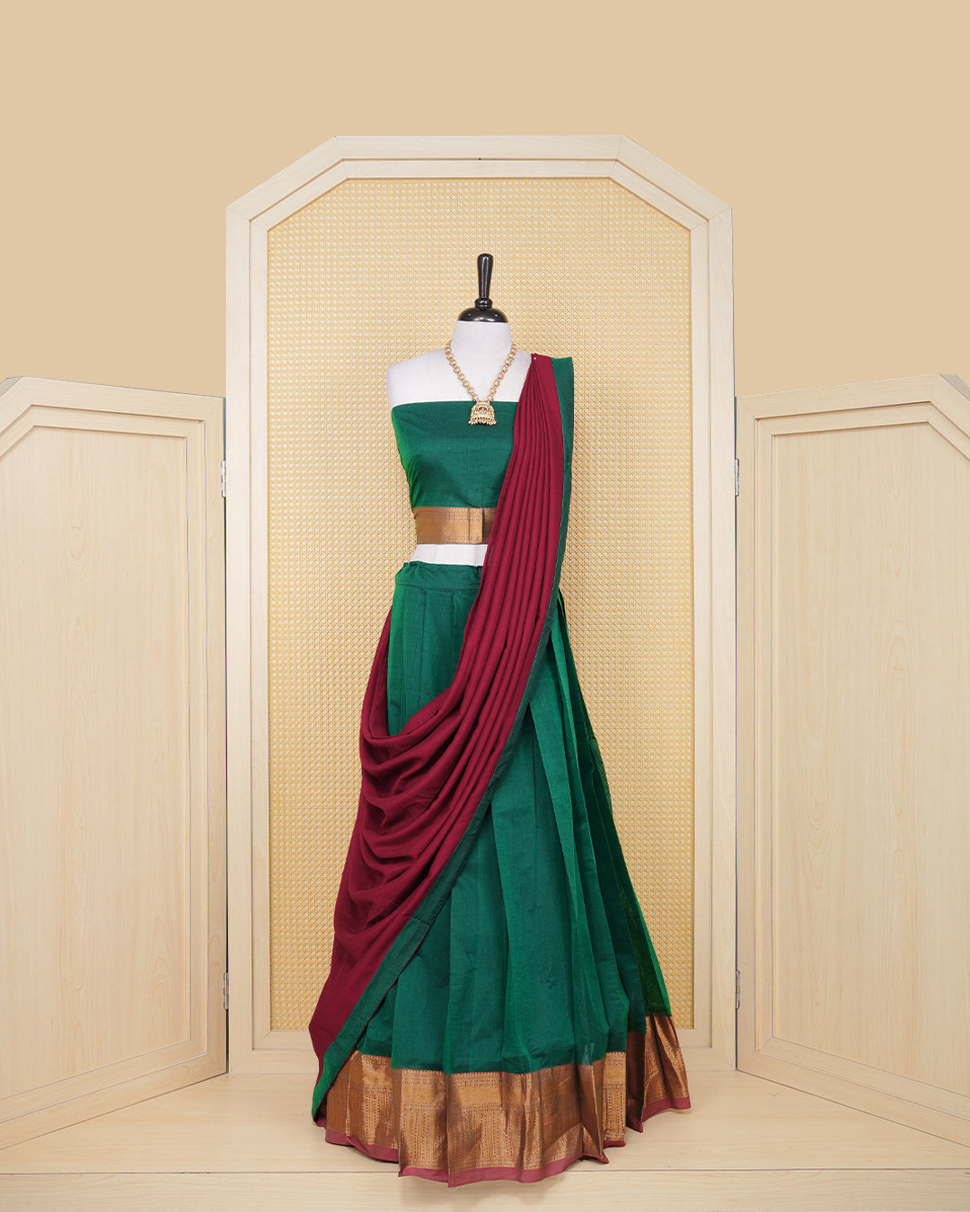 Bottle green colour Chettinad Semi Stitched dhavani set Featuring brick red with Gold zari on skirt, matching Blouse & Contrast dupatta.
