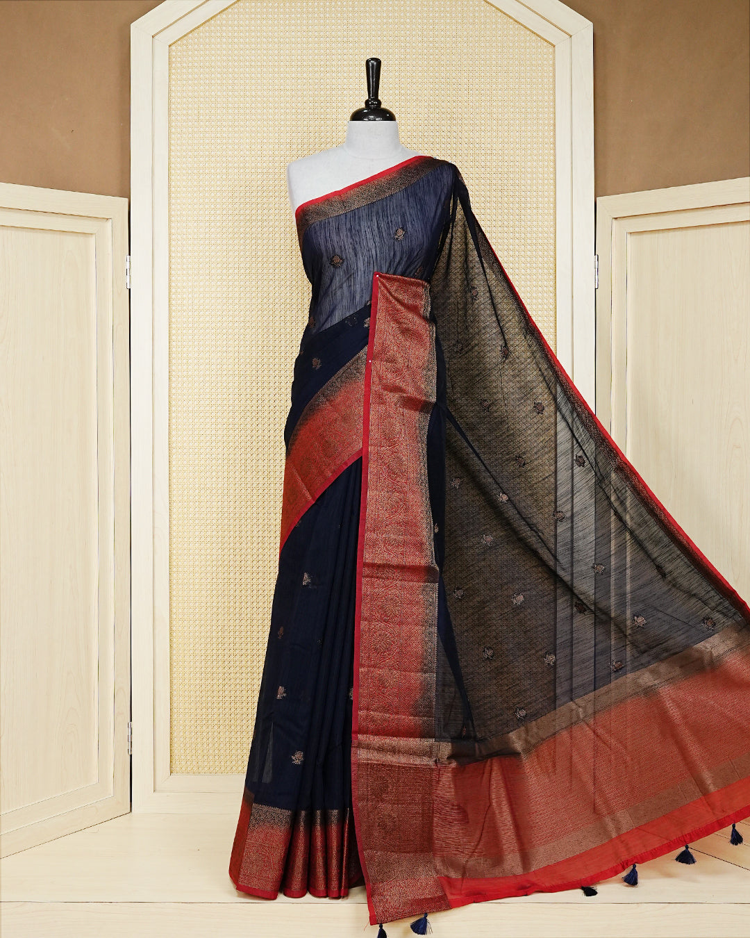 Navy blue colour semi linen saree thread motifs on body, contrast red colour gold zari border, rich pallu comes with matching blouse piece