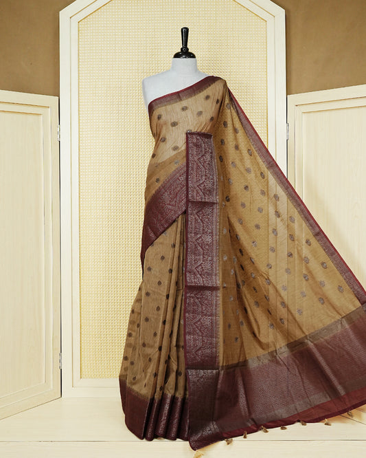 Sandal colour semi linen saree thread motifs on body, contrast maroon colour gold zari border, rich pallu comes with matching blouse piece