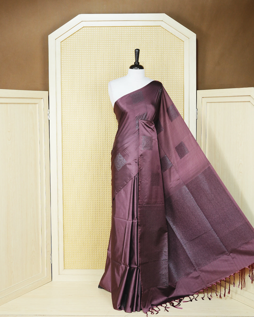 Dark mauve colour soft silk saree featuring antique zari motifs on body with contrast self colour pallu & paired with matching blouse piece.
