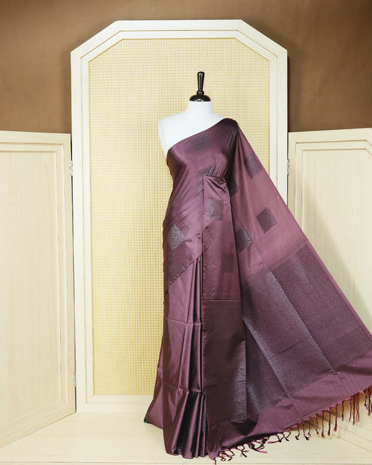 Dark mauve colour soft silk saree featuring antique zari motifs on body with contrast self colour pallu & paired with matching blouse piece.