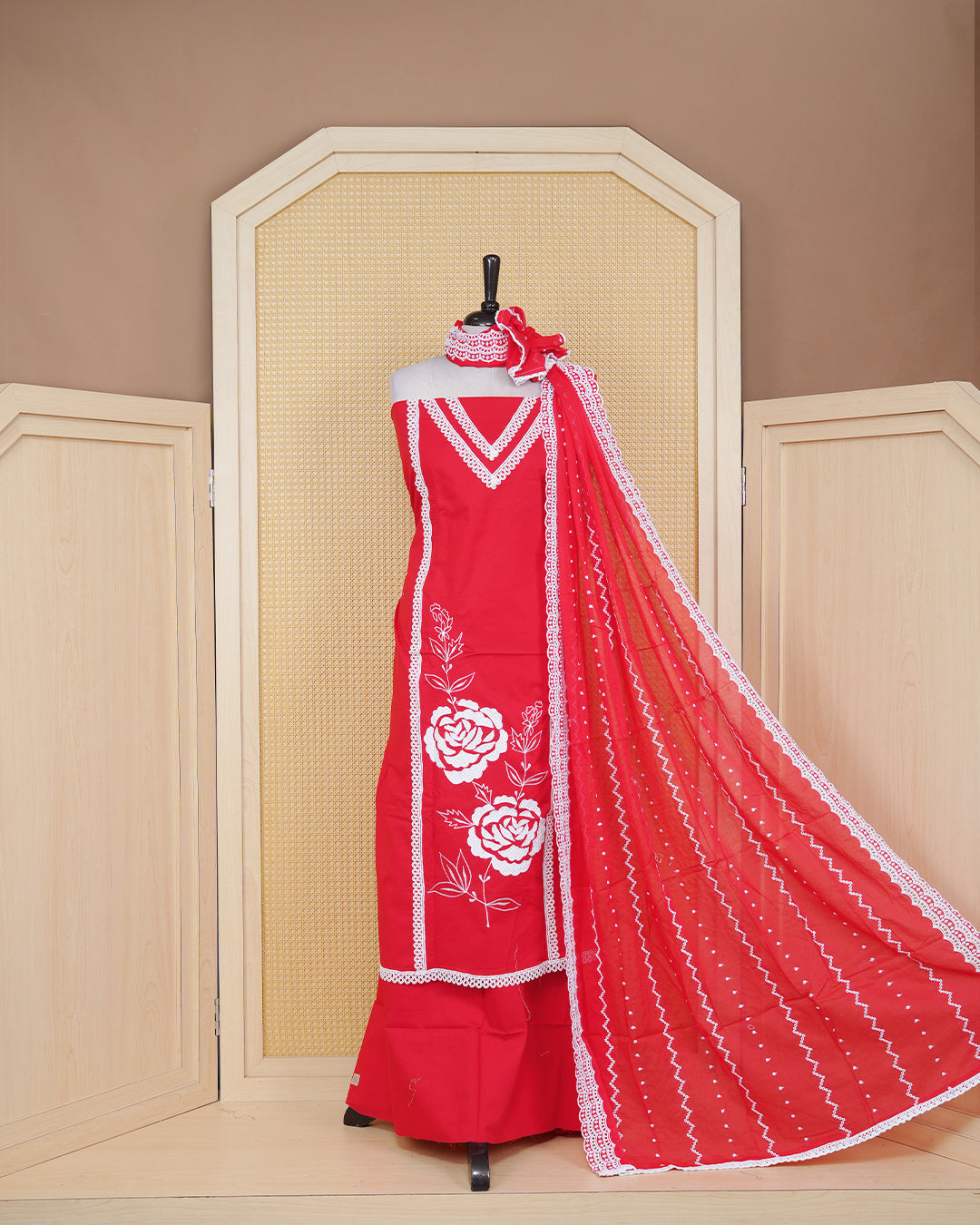 Red colour Cotton Salwar Material Featuring an Threadwork on Body, lace work on neck portion, Paired With a Matching Bottom and an Elegant Dupatta.