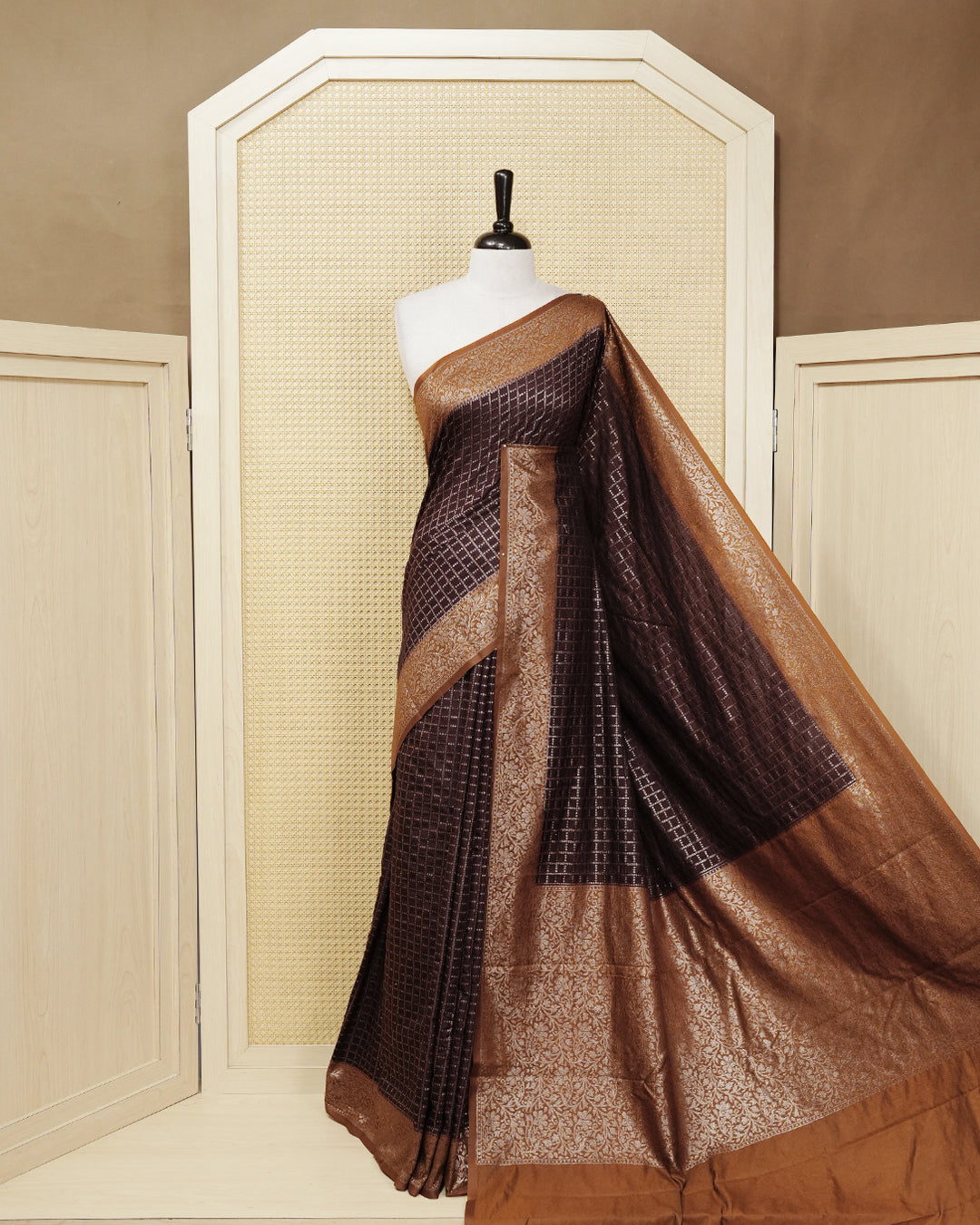 Dark coffee brown Colour Semi georgette Saree having zari dotted check pattern on body, contrast dark mustard colour floral kodi designed Border, Rich Pallu comes with Matching Blouse piece.