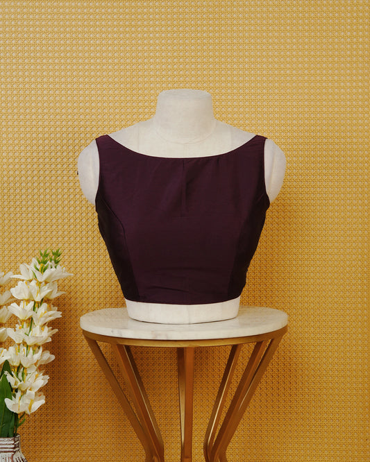 Purple Colour Sleeveless Blouse Featuring A Classic Boat Neck, Smooth Finish, And A Comfortable Tailored Fit.